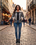 Women's gray leather shearling jacket with soft ivory collar and fitted waist, full body view, The Wilder Gray